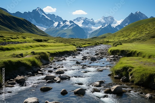 Mountain river flowing through a green valley on a sunny day