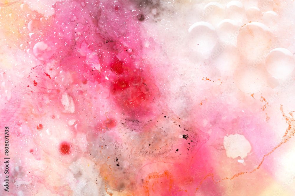 Abstract art with pink, red and yellow watercolour splashes and dots for creative background or wallpaper macro