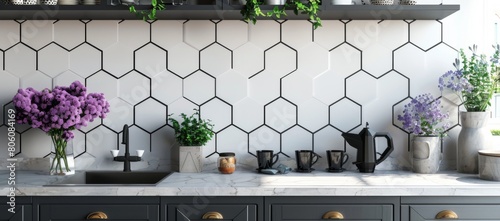 white and grey hexagon tiles with black grout in a kitchen, with a white wall, dark gray cabinets, black mugs on the countertop, purple flowers, a coffee pot, a cutlery set, wall decor photo