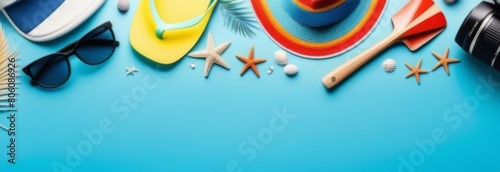 Hat, flip flops, starfish, shells and glasses on a blue background. Banner, free space for text photo