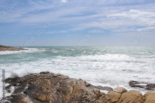 Fototapeta Naklejka Na Ścianę i Meble -  travel, beautiful view of the sea coast of the Mediterranean Sea in  Spain, sea wave on rocks against cloudy sky, sea coast with waves, waves on the beach