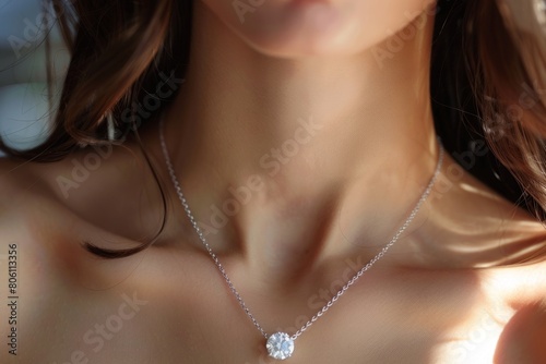 Elegant Woman Showcasing Sparkling Diamond Pendant Necklace  photo