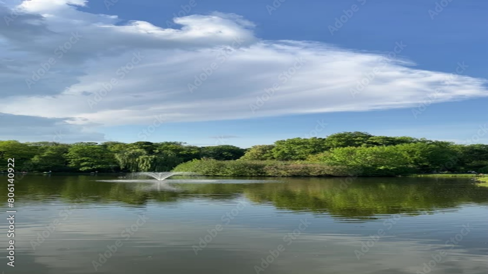 A beautiful vertical 4K landscape featuring a serene park with a decorative fountain, surrounded by lush greenery. Perfect for nature, relaxation, and urban scenery themes. A beautiful vertical 4K landscape featuring a serene park with a decorative fountain, surrounded by lush greenery. Perfect for nature, relaxation, and urban scenery themes.