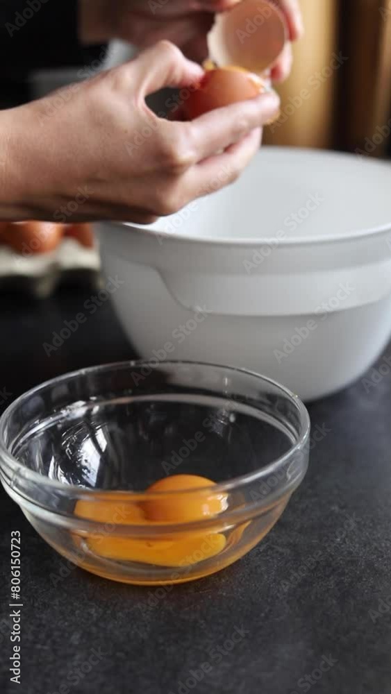 Separating egg yolks from egg whites, ingredients for cake Separating egg yolks from egg whites, ingredients for cake