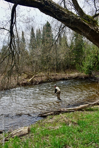 Angler fishing in a river