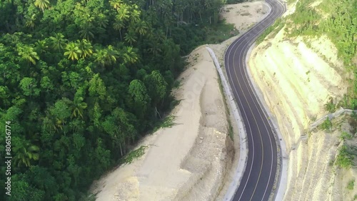 drone lifts off to capture breathtaking aerial footage of the South Coast Road in Tulungagung, East Java, Indonesia. photo