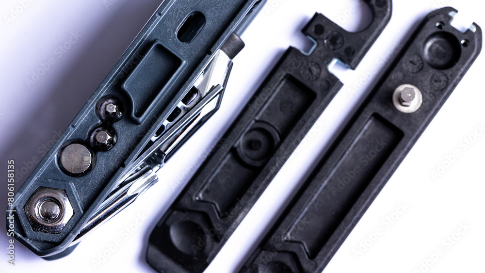 Black bicycle multifunctional multitool unfolded on a white background. Chrome steel tools. Tools for bicycle self-repairing .