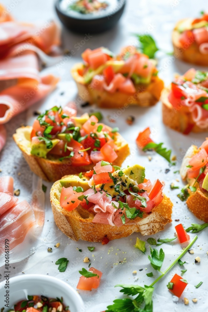 Turkey ham bruschetta on sliced avocado on a white background