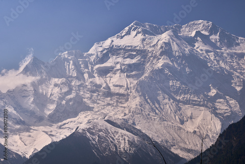 Summit of the mount Annapurna II as seen from the village Upper Pisang on the Annapurna Circuit trek. Close up view. Himalaya, Nepal.