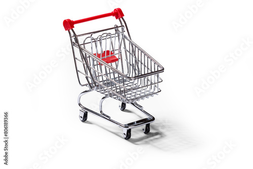 Empty grocery cart on clean white background with shadow.