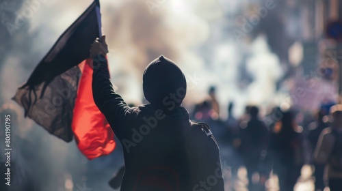 Determined Protester Holding Flag in Sharp Contrast with Blurred Crowd AI Generated. photo