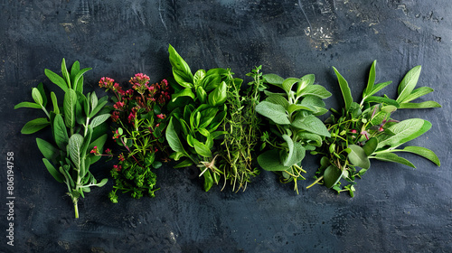 A lot of scattered spices and herbs are depicted on a black isolated background.