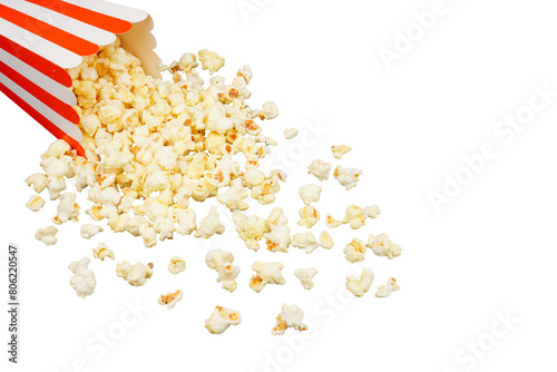 Salted popcorn spilling out of red and white cardboard box used as a border frame