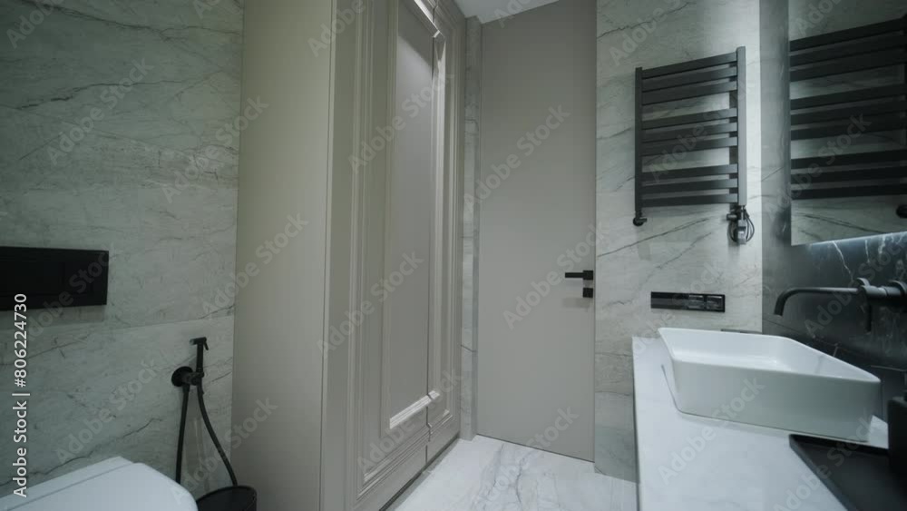 Contemporary Bathroom with Marble Accents and Vertical Lighting Contemporary Bathroom with Marble Accents and Vertical Lighting