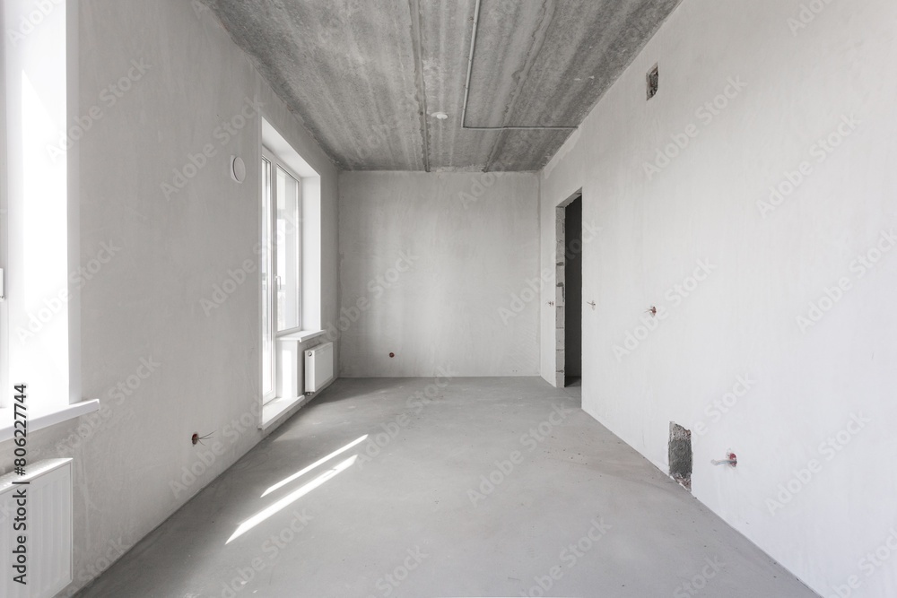 interior of the apartment without decoration in gray colors. rough finish interior of the apartment without decoration in gray colors. rough finish