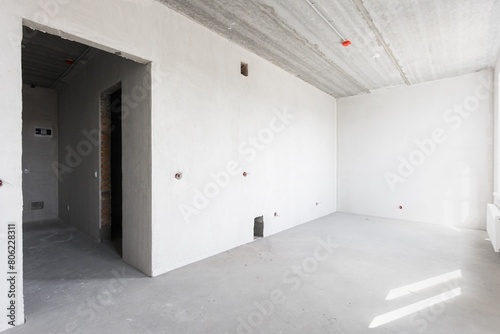 interior of the apartment without decoration in gray colors. rough finish