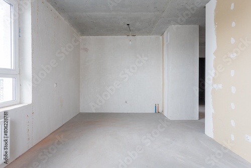 interior of the apartment without decoration in gray colors. rough finish