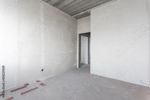 interior of the apartment without decoration in gray colors. rough finish