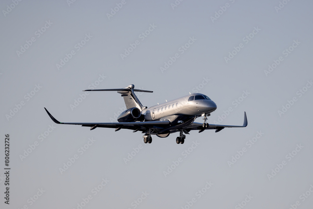 Fototapeta premium Graceful Touchdown: Embraer Praetor 600 at Warsaw Chopin Airport