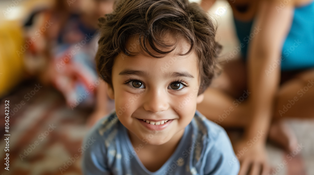 Joyful young boy with a beaming smile, sparkling eyes, sitting in a home setting, radiating happiness and innocence. Joyful young boy with a beaming smile, sparkling eyes, sitting in a home setting, radiating happiness and innocence.