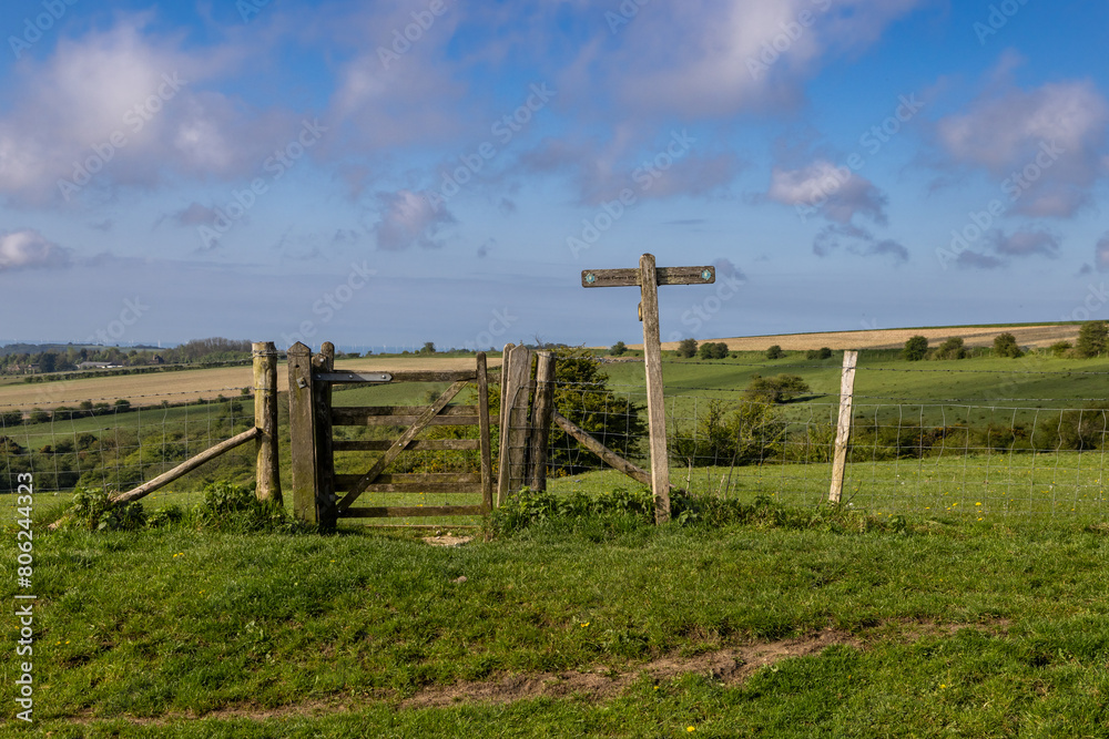 A wooden gate and signpost on Ditchling Beacon, along the South Downs Way