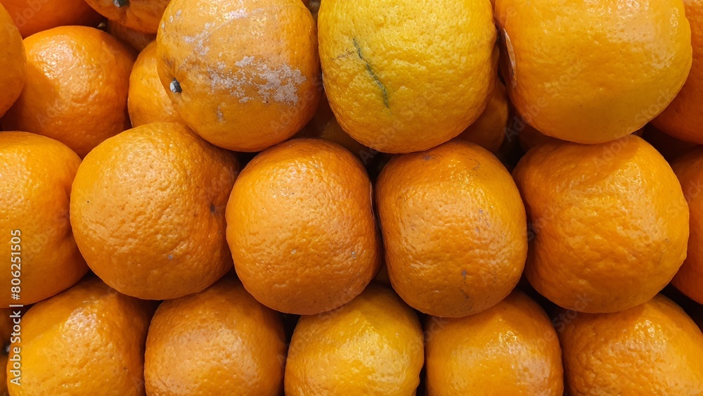 Close up pile of tasty fresh oranges sold at the market as a background. Close up pile of tasty fresh oranges sold at the market as a background.