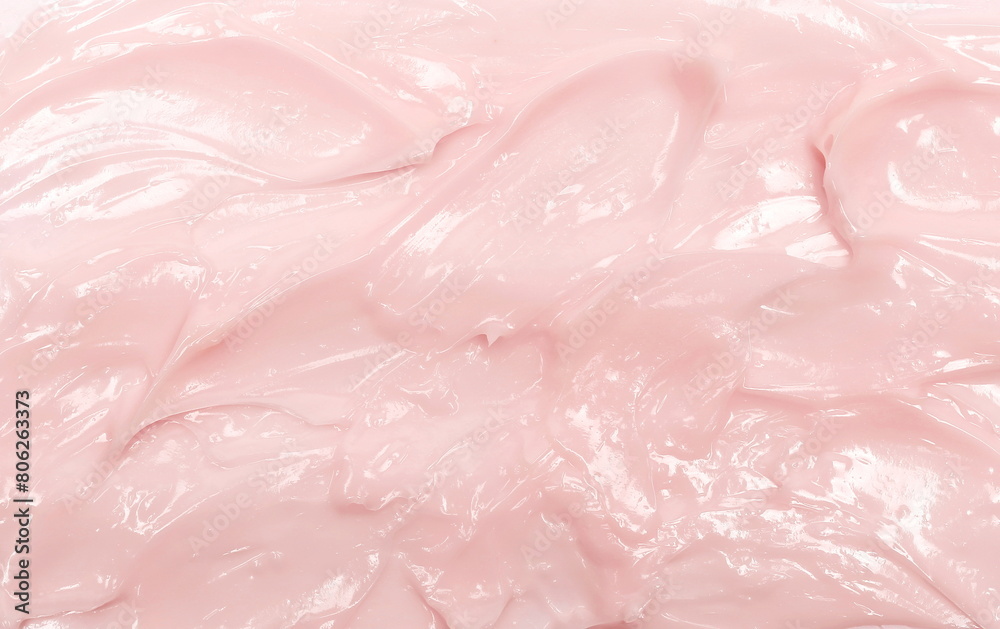 Pink cosmetic cream spread, spilled background and texture Pink cosmetic cream spread, spilled background and texture