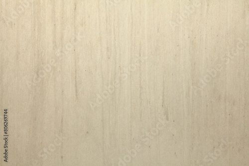 Yellowed silver-color metal wall, texture, background. Dirty, silvery surface with streaks of dirt. Gray metal wall in pastel color that faded in the sun. Smooth surface of uneven color, splash screen photo