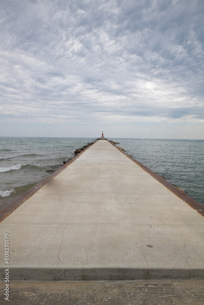 Light house warning tower on the breakwater wall