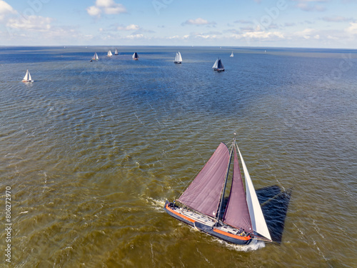 Aerial from sailing competition at Stavoren in the Netherlands with traditional historical sailing boats