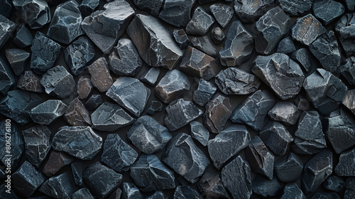 A textured surface of anthracite coal, showcasing its gleaming facets and deep black color, commonly used as a fossil fuel for heating and energy.