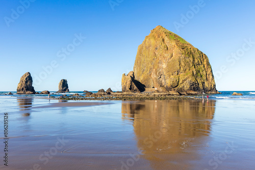 The tide out at Haystack Rock in Cannon Beach Oregon photo