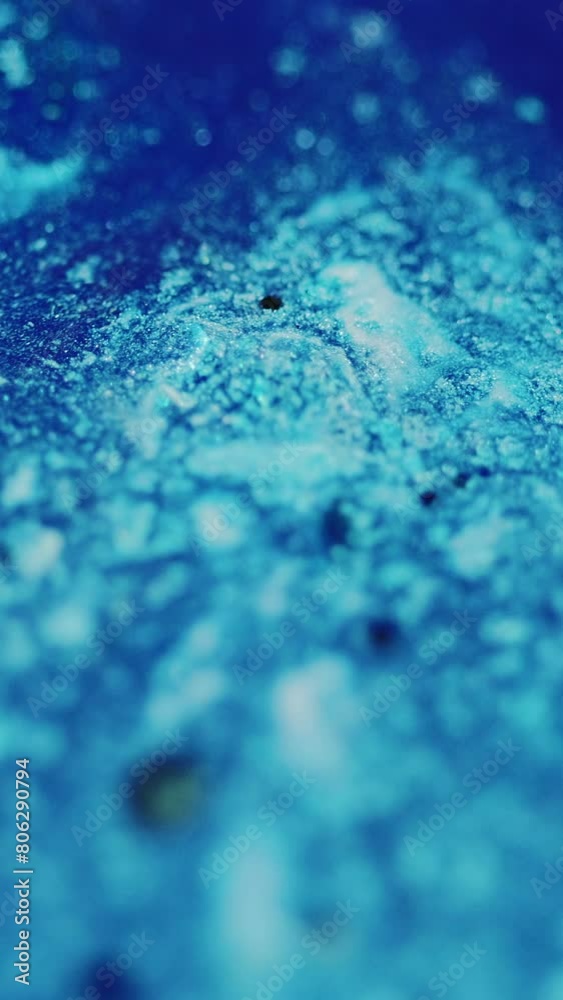 Vertical video. Shimmering paint background. Ink flow. Liquid blend. Glowing defocused blue black sequins mix drip motion in abstract trendy acrylic pigment art. Vertical video. Shimmering paint background. Ink flow. Liquid blend. Glowing defocused blue black sequins mix drip motion in abstract trendy acrylic pigment art.