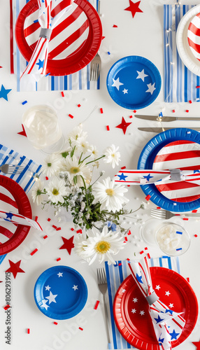 Festive Independence Day Setup: Stylish Fourth of July Tabletop with Patriotic Plates and Centerpieces - Clean composition, Ample negative space, vertical composition  photo