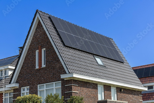 Detail of solar panels on a family house integrated on the roof. View of solar panels (solar cell) in the roof house