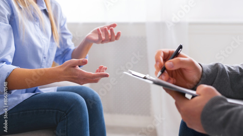 Emotional woman sharing her troubles and gesturing at psychotherapy session  panorama