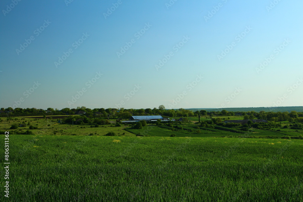 A large green field with white letters