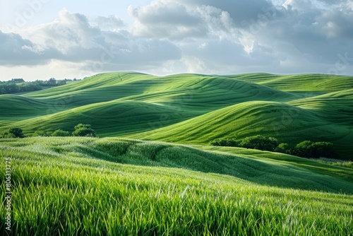 Green rolling hills under cloudy sky