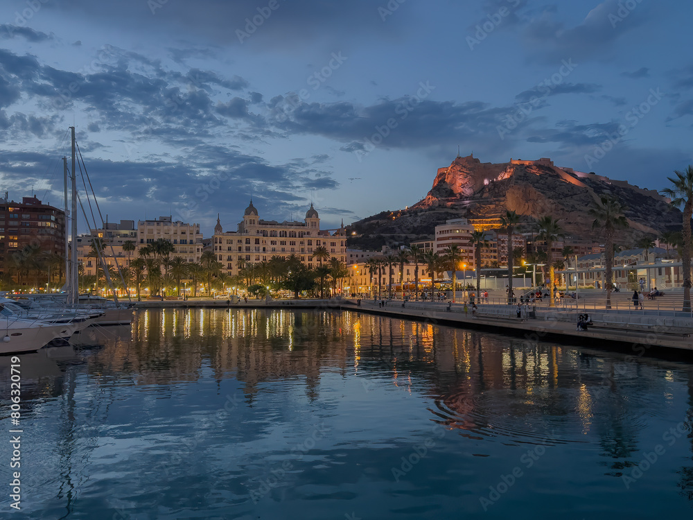 Fototapeta premium Night view of the port and castle Santa Barbara in Alicante