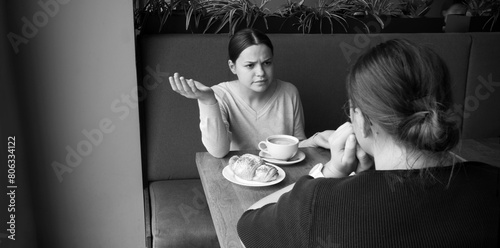 Two girls talking in cafe © Marina