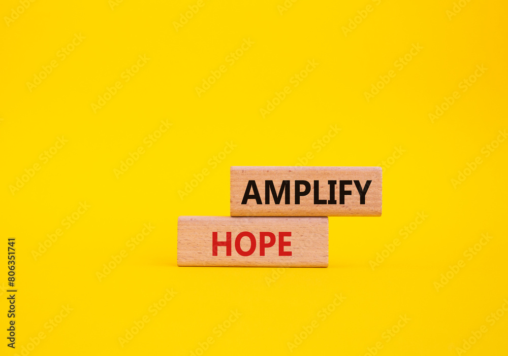 Amplify Hope symbol. Wooden blocks with words Amplify Hope. Beautiful yellow background. Business and Amplify Hope concept. Copy space. Amplify Hope symbol. Wooden blocks with words Amplify Hope. Beautiful yellow background. Business and Amplify Hope concept. Copy space.