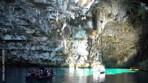 Zakynthos, Greece - September 25, 2022: Bunch of tourists on a boat in the famous melissani lake on Kefalonia island