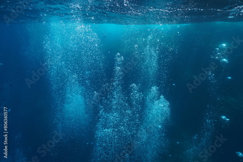 Air bubbles underwater rising to water surface in the Mediterranean sea, natural scene, Spain