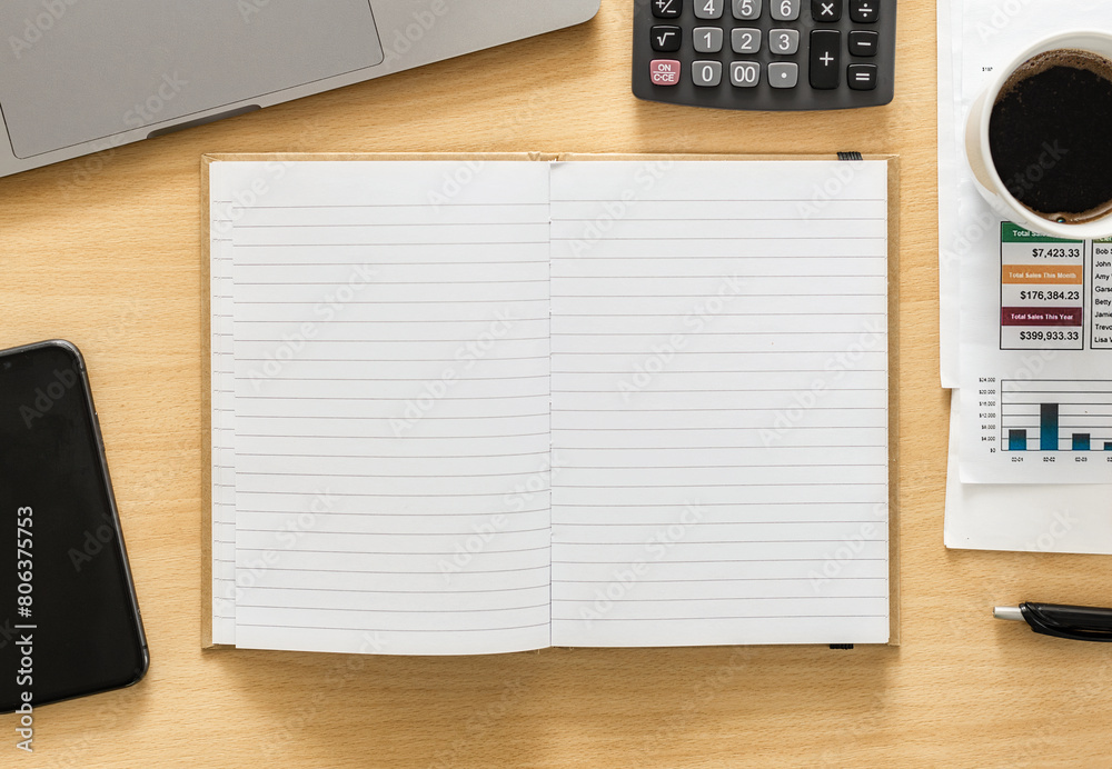 Open blank notebook in workplace top view Open blank notebook in workplace top view