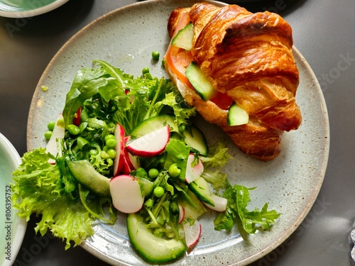 Croissant and Microgreens Breakfast Served on a Plate