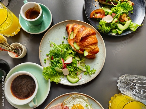 Breakfast Plates with Ham and Eggs Croissant on Plates and Coffee