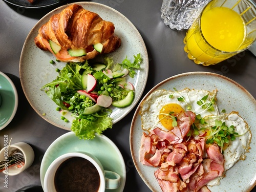 Breakfast Plates with Ham and Eggs Croissant on Plates and Coffee