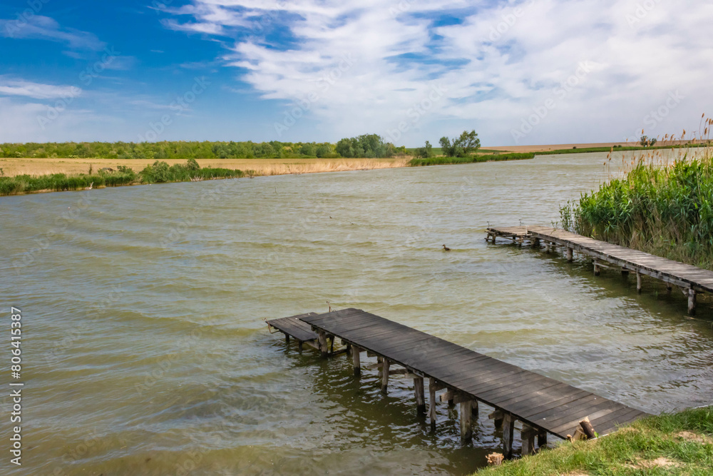 Fototapeta premium Old wooden docks at the Vranjas lake in Vojvodina, Serbia