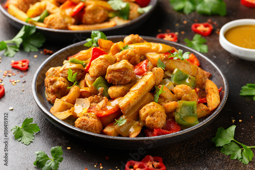 Fototapeta Naklejka Na Ścianę i Meble -  Irish spice bag take away food with potato fries, fried chicken, vegetables and curry sauce