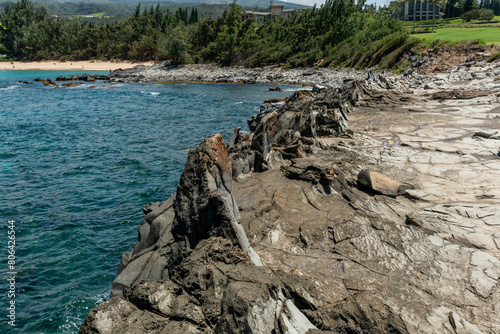 Scenic Honokahua bay vista with Dragon's Teeth rocks in the foreground, Maui, Hawaii photo